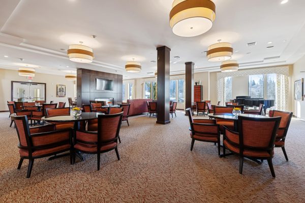 A large seating area with tables and chairs.