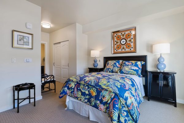 Another view of the bed in the bedroom.