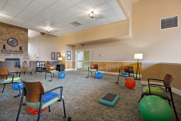 Six chairs in a circle with exercise balls beside them.