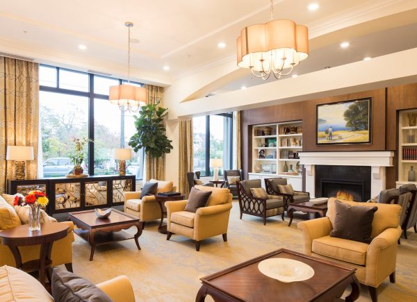 The lobby with couches, coffee tables, and a fireplace