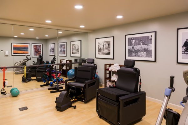 An exercise room with various types of equipment