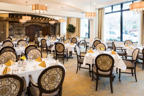 A large dining room with tables and chairs