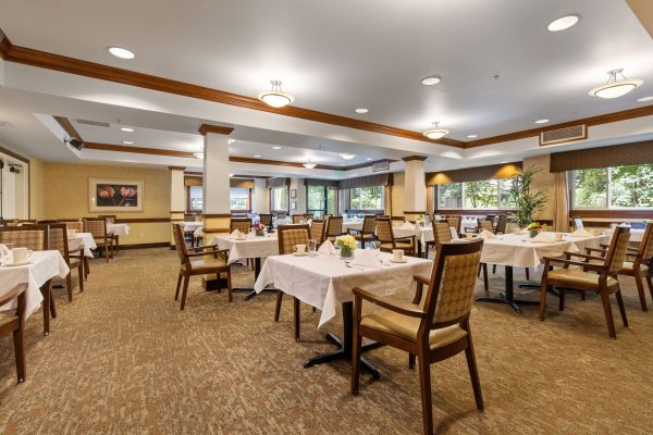 A dining area with tables and chairs.