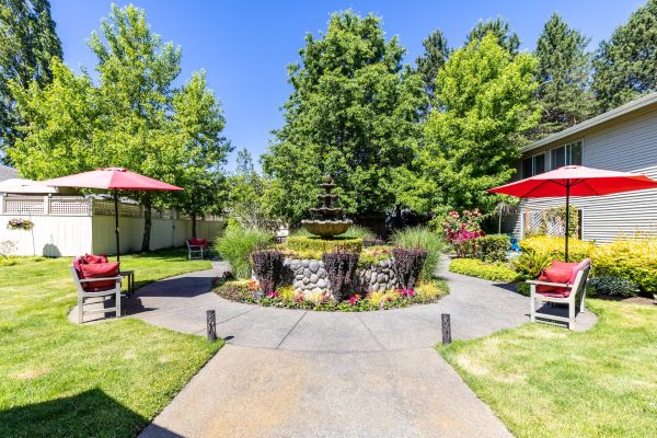 A wider view of the fountain; there’s a walking path and seating areas on either side