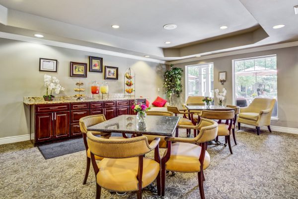 A seating area with tables and chairs