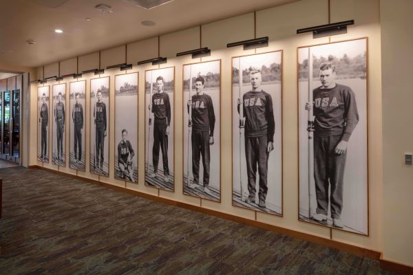 Large black and white photos of men wearing USA sweatshirts