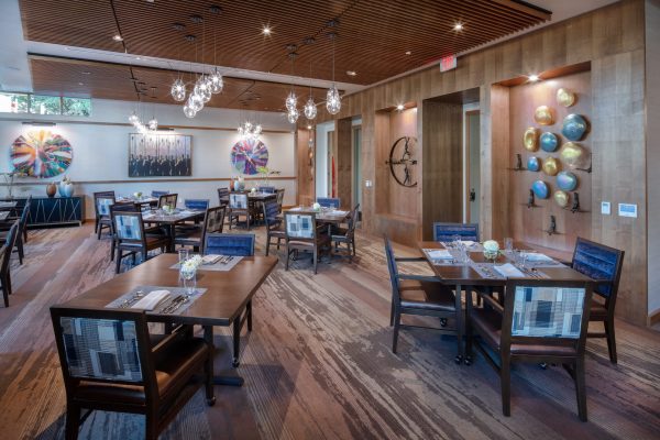 A modern eating area with tables and chairs