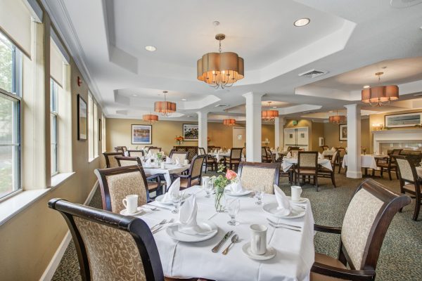 A large dining room with tables and chairs