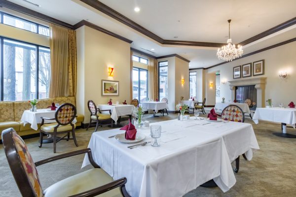 A dining area with several tables and chairs