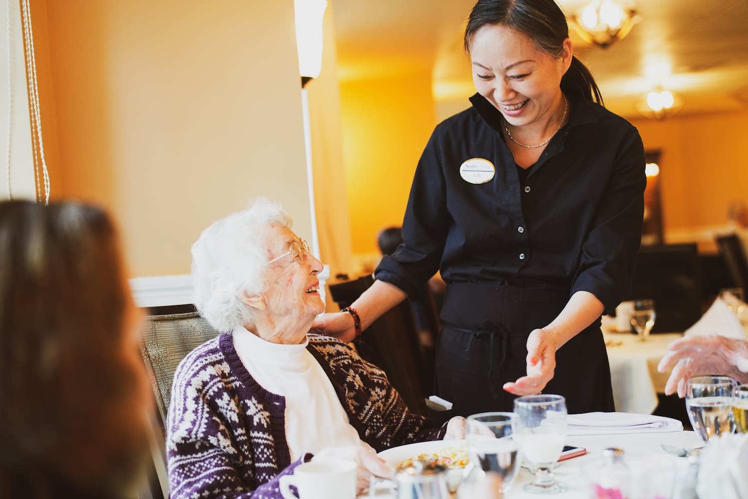 A resident being served a meal