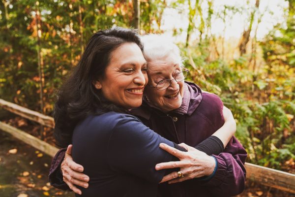 A female resident hugging a woman