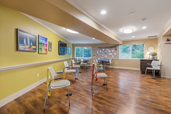 An exercise room with chair set up facing the front