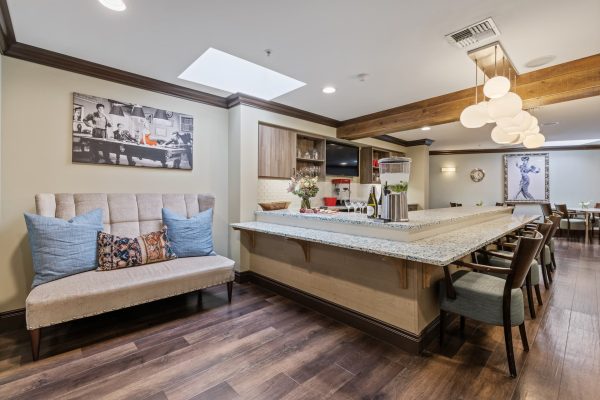 A bar area with chairs and a couch