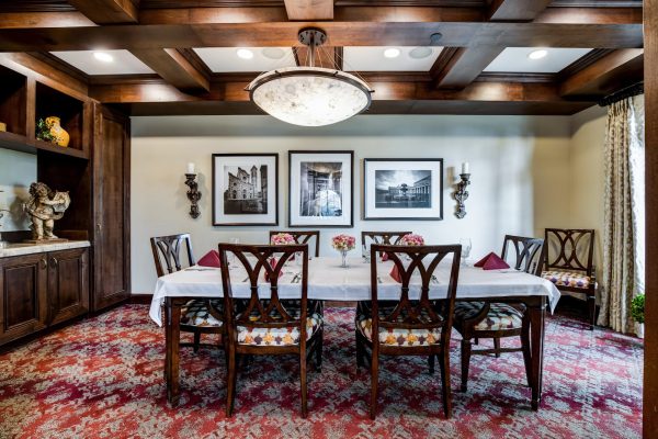 A long dining table with chairs