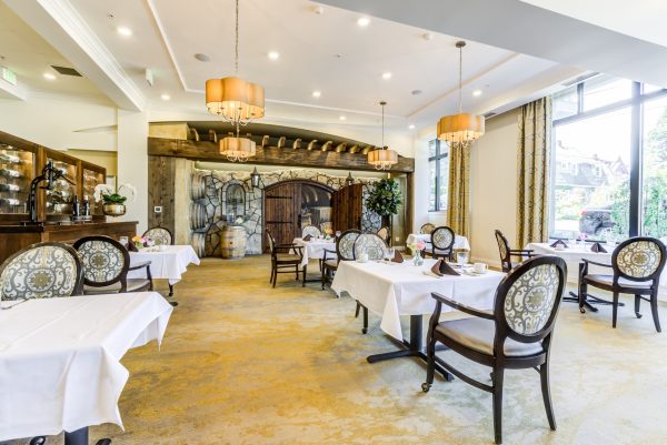 A large dining room with tables and chairs