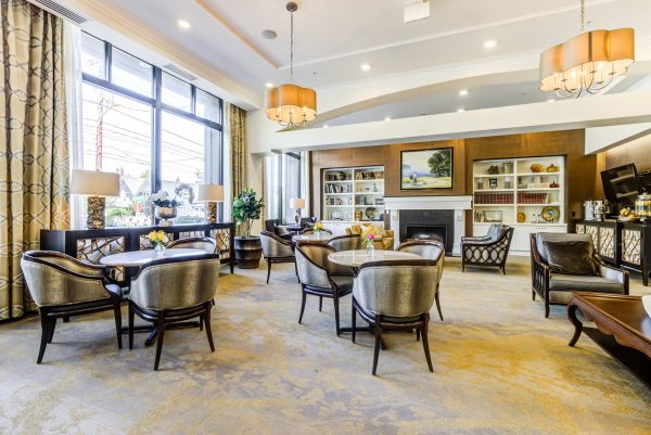 The lobby with tables and chairs and a fireplace