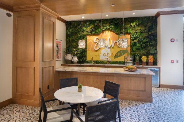 A juice bar with a table and four chairs