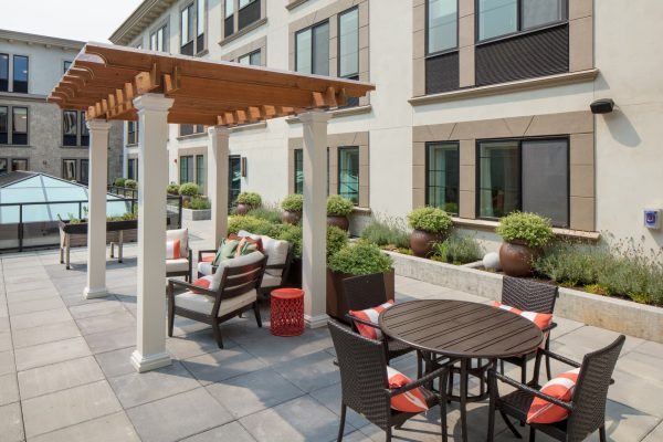 An outdoor seating with tables and chairs