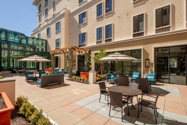 Patio seating areas outside of Aegis Living Bellevue.