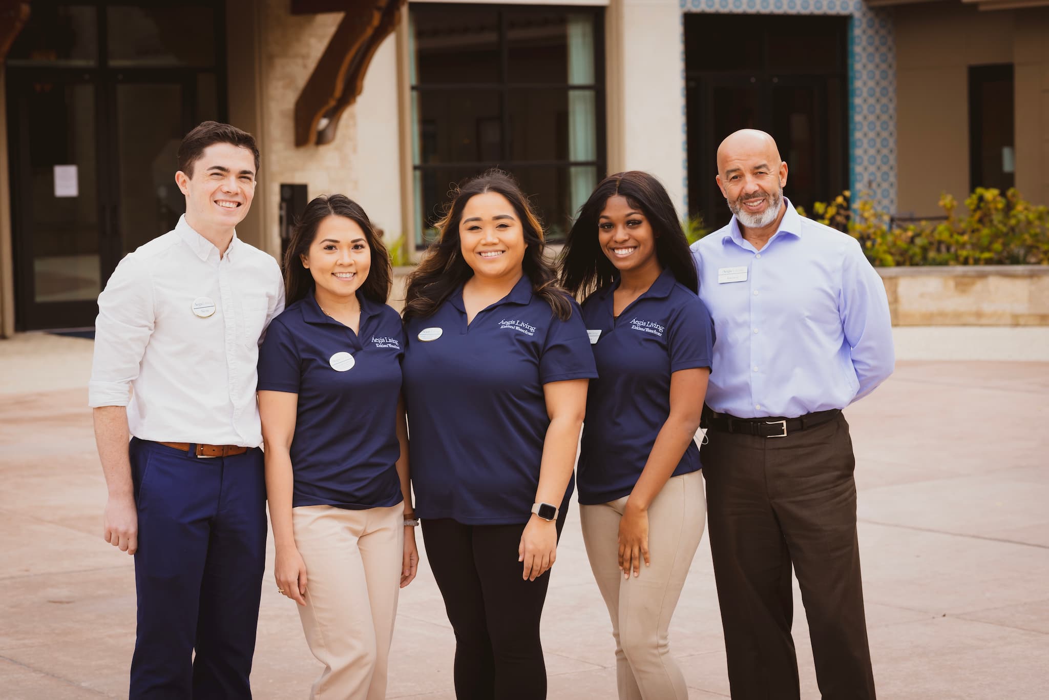 A group of employees outside of Aegis Living