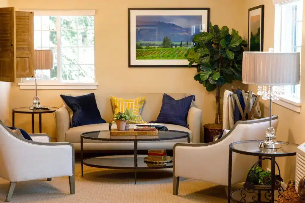 Cozy living room with modern decor and plants.